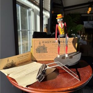 Vintage 1915 Ragtime Rastus dancing doll, a phonograph accessory / toy